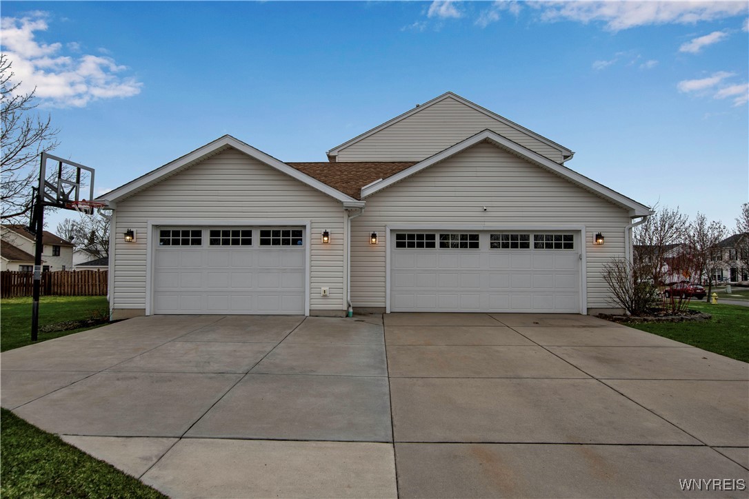 285 Enchanted Forest North Lancaster, NY 14086 - Photo 2 of 50 Garage on the left was added in 2016. Heated, epox