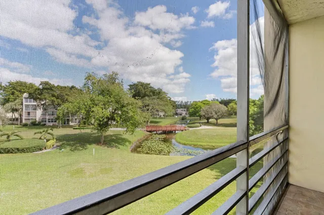 a kitchen with granite countertop cabinets stainless steel appliances and a sink