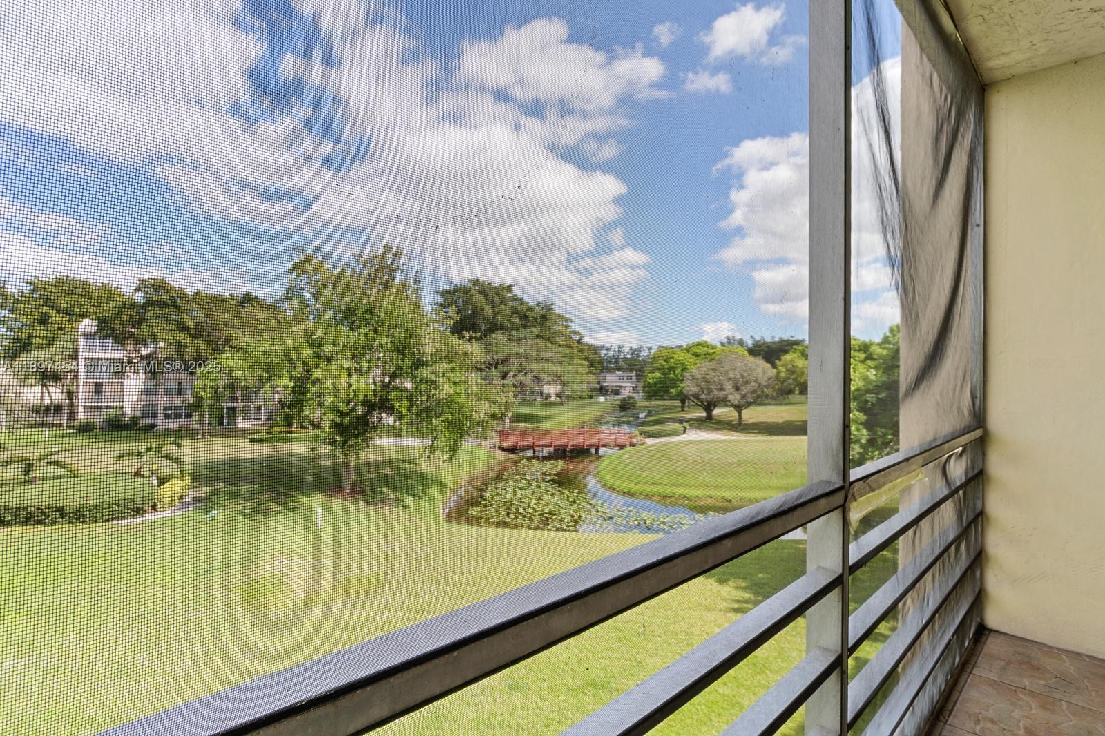 9451 Evergreen Place, Unit 303 Davie, FL 33324 - Photo 12 of 23 a view of swimming pool from a window