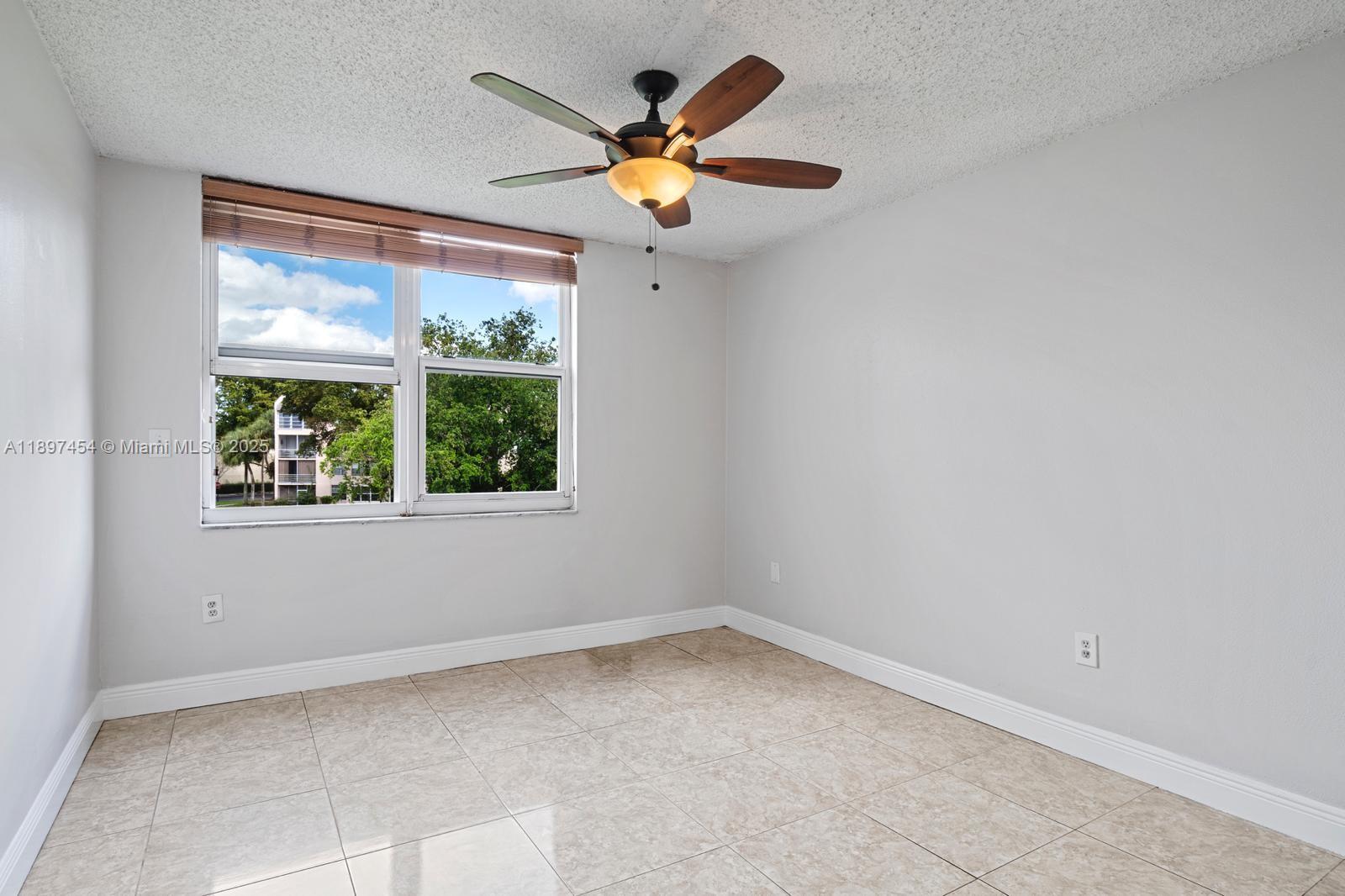 9451 Evergreen Place, Unit 303 Davie, FL 33324 - Photo 16 of 23 an empty room with a window