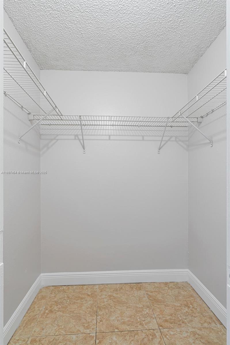 9451 Evergreen Place, Unit 303 Davie, FL 33324 - Photo 19 of 23 a view of a room with racks on the wall