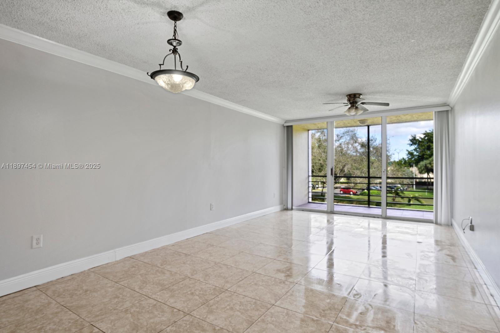 9451 Evergreen Place, Unit 303 Davie, FL 33324 - Photo 7 of 23 a view of an empty room with a window