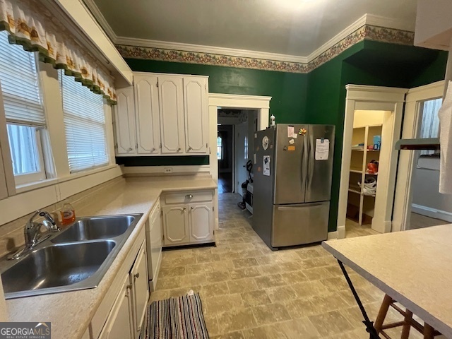 503 North Church Street Thomaston, GA 30286 - Photo 21 of 45 a kitchen with a sink and refrigerator