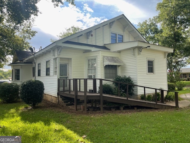 503 North Church Street Thomaston, GA 30286 - Photo 40 of 45 a view of backyard with a garden and deck