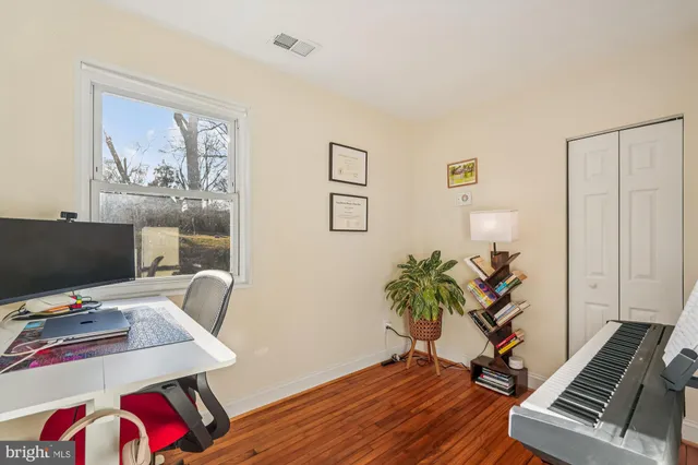a workspace with furniture and wooden floor