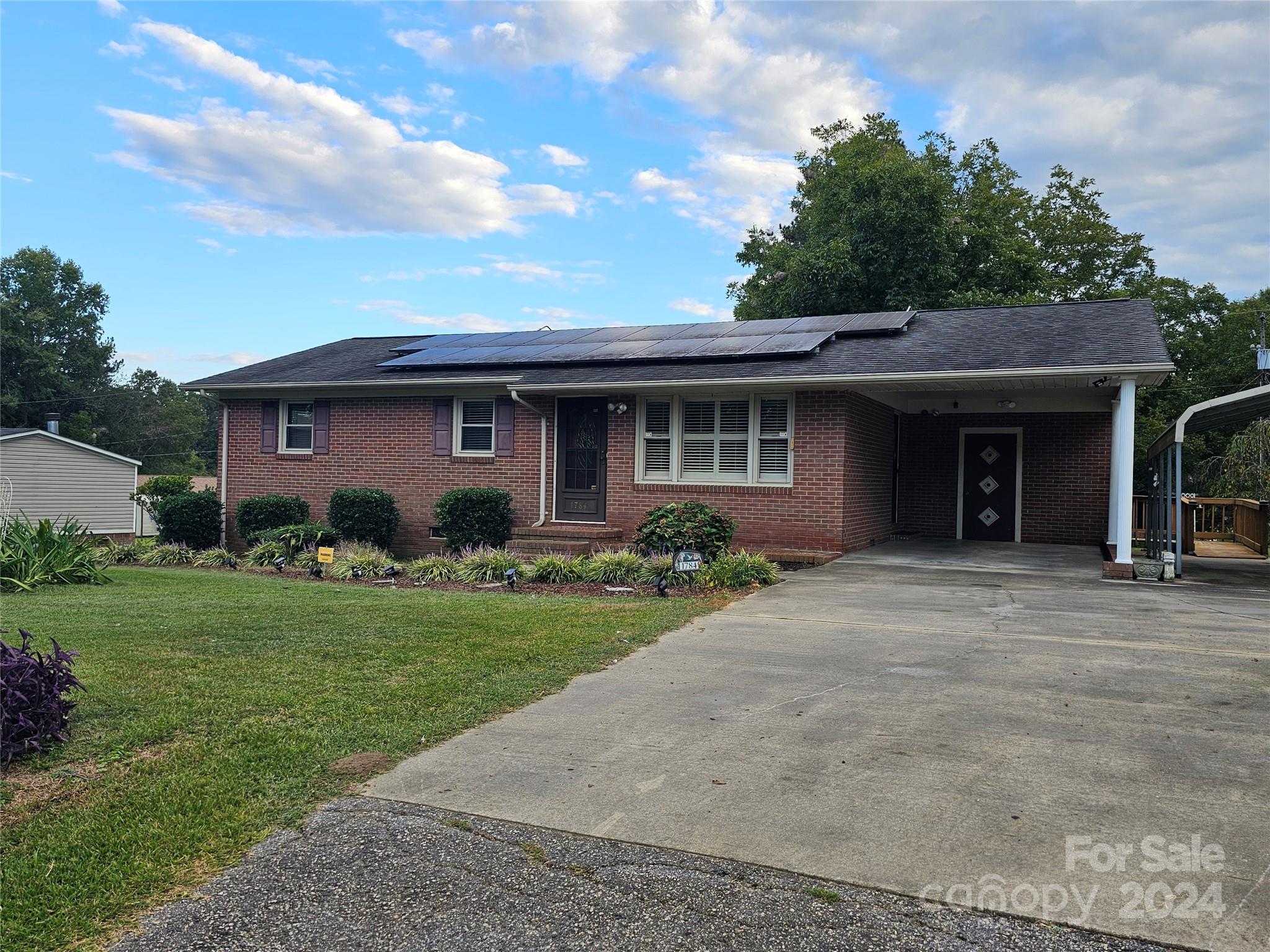 1784 Deaton Drive Lancaster, SC 29720 - Photo 2 of 19 a front view of a house with a garden