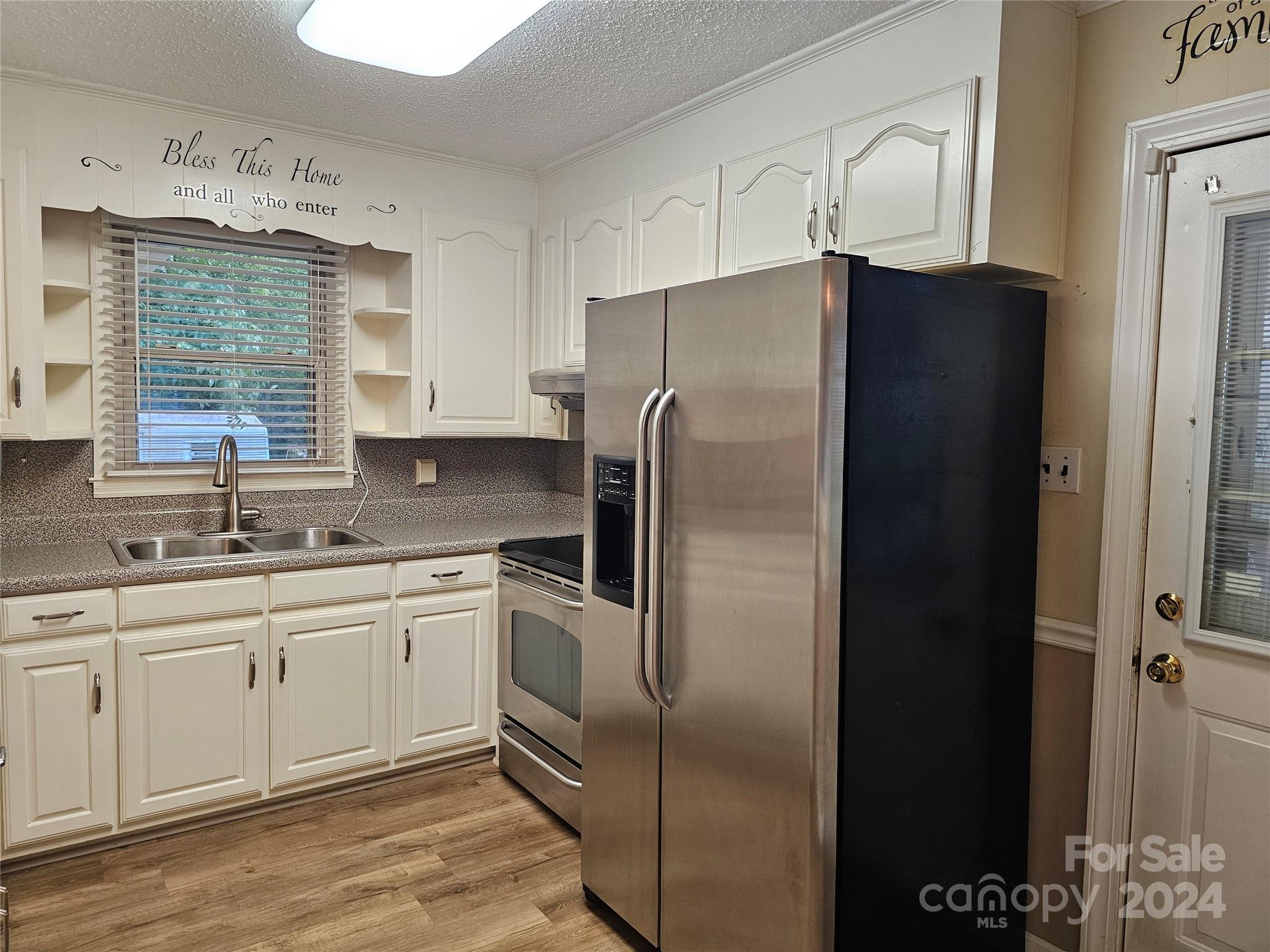 1784 Deaton Drive Lancaster, SC 29720 - Photo 5 of 19 a kitchen with stainless steel appliances granite countertop a refrigerator and a sink