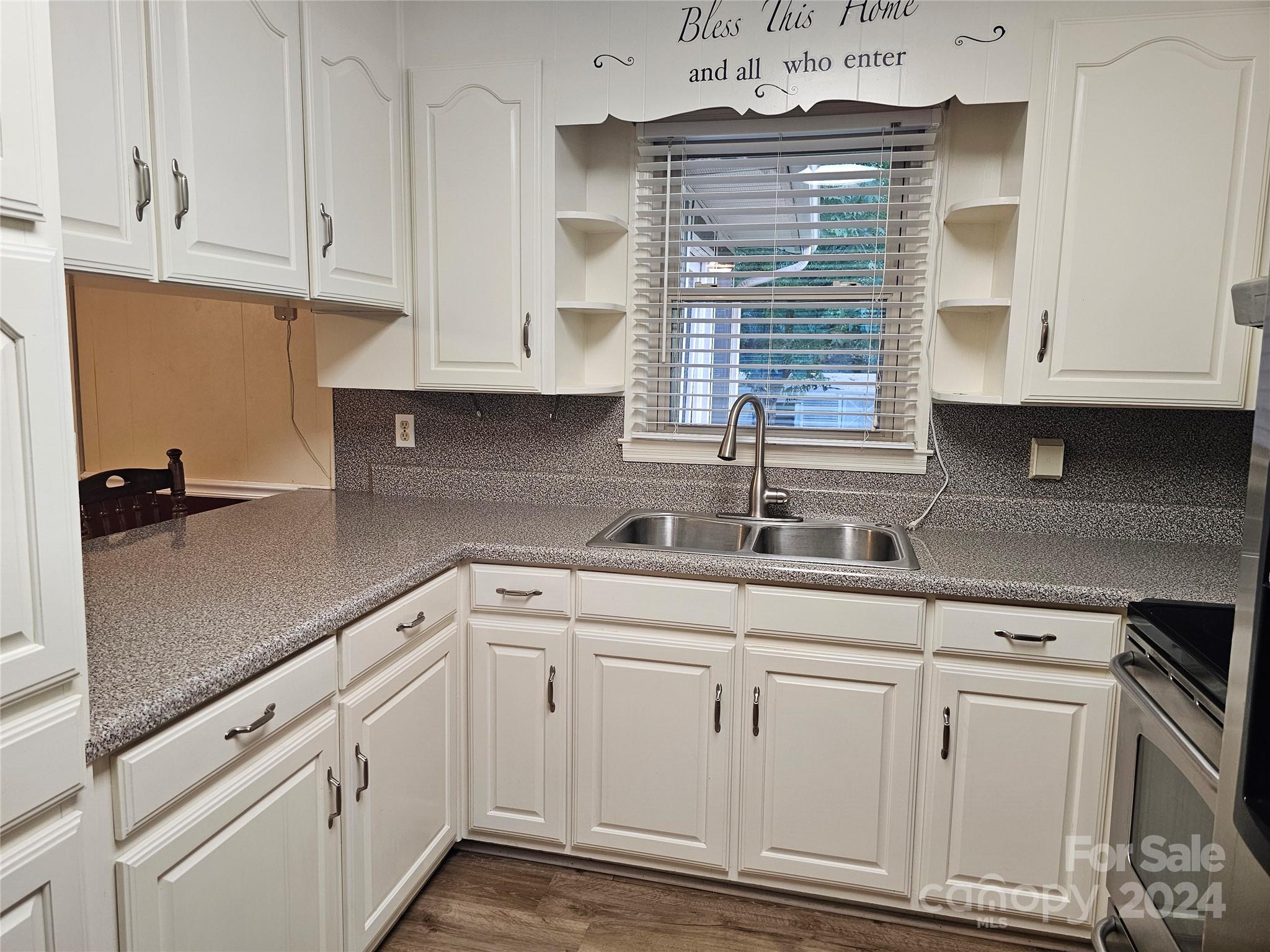 1784 Deaton Drive Lancaster, SC 29720 - Photo 7 of 19 a kitchen with white cabinets and white appliances