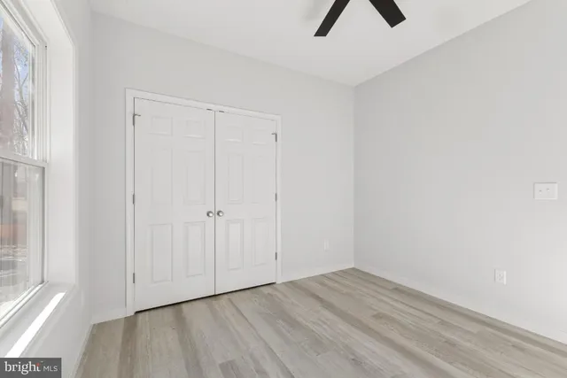 a view of a house with backyard porch and sitting area