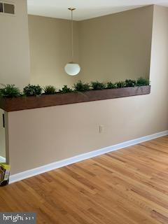 102 Bunker Hill Road New Cumberland, PA 17070 - Photo 2 of 23 a view of a room with wooden floor and lots of frames on wall