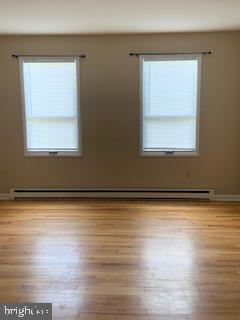 102 Bunker Hill Road New Cumberland, PA 17070 - Photo 3 of 23 a view of a room with wooden floor and a window