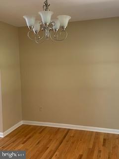102 Bunker Hill Road New Cumberland, PA 17070 - Photo 4 of 23 a view of a room with wooden floor and chandelier