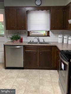 102 Bunker Hill Road New Cumberland, PA 17070 - Photo 5 of 23 a kitchen with stainless steel appliances granite countertop a stove a sink and a microwave