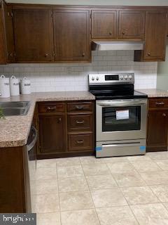 102 Bunker Hill Road New Cumberland, PA 17070 - Photo 6 of 23 a kitchen with stainless steel appliances granite countertop a stove and a sink