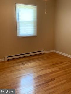 102 Bunker Hill Road New Cumberland, PA 17070 - Photo 10 of 23 a view of a room with wooden floor and a window