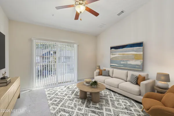 a living room with furniture and a window