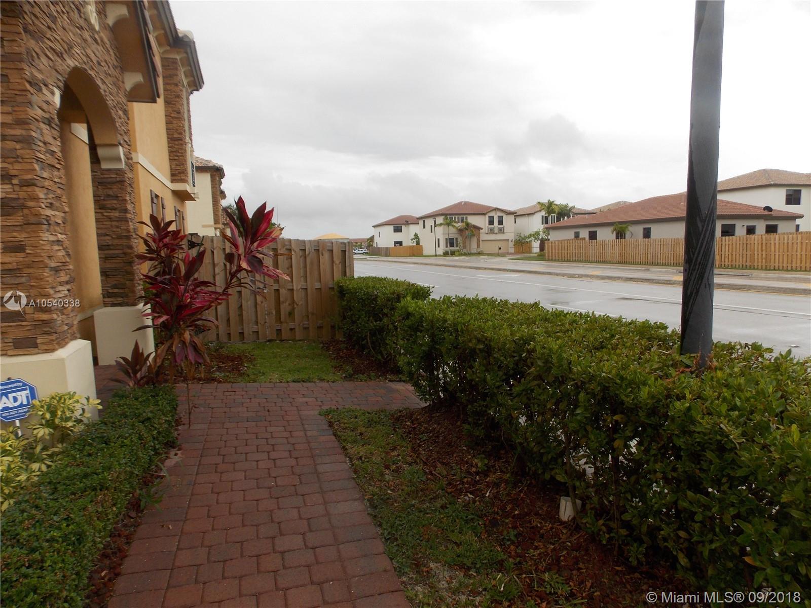 11646 Southwest 234th Street Homestead, FL 33032 - Photo 8 of 63 Walkway from Garage