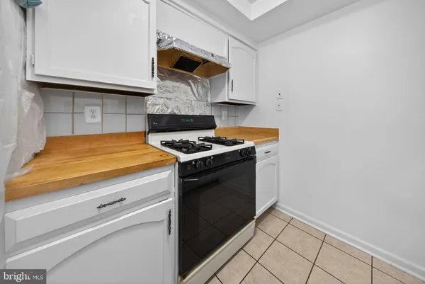a kitchen with a stove and a microwave