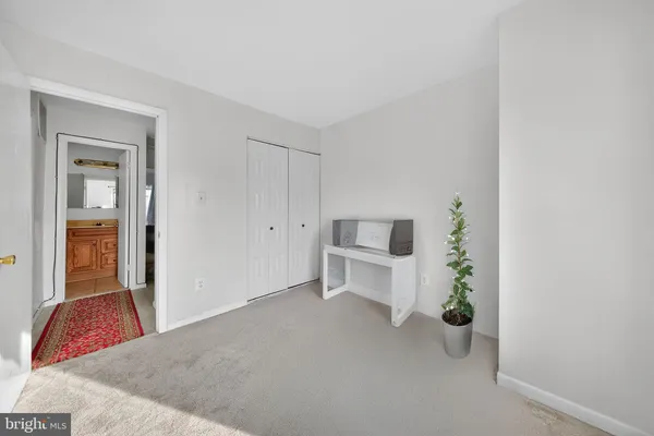 a view of room with furniture and closet
