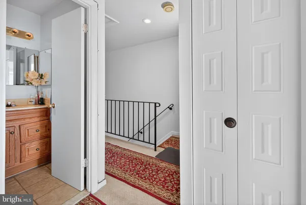 a view of a hallway with closet area