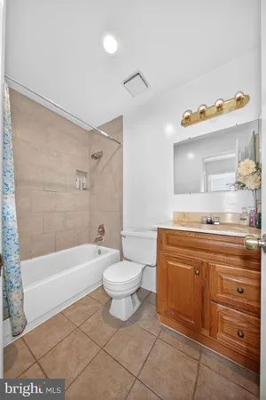 a bathroom with a sink a toilet and bathtub