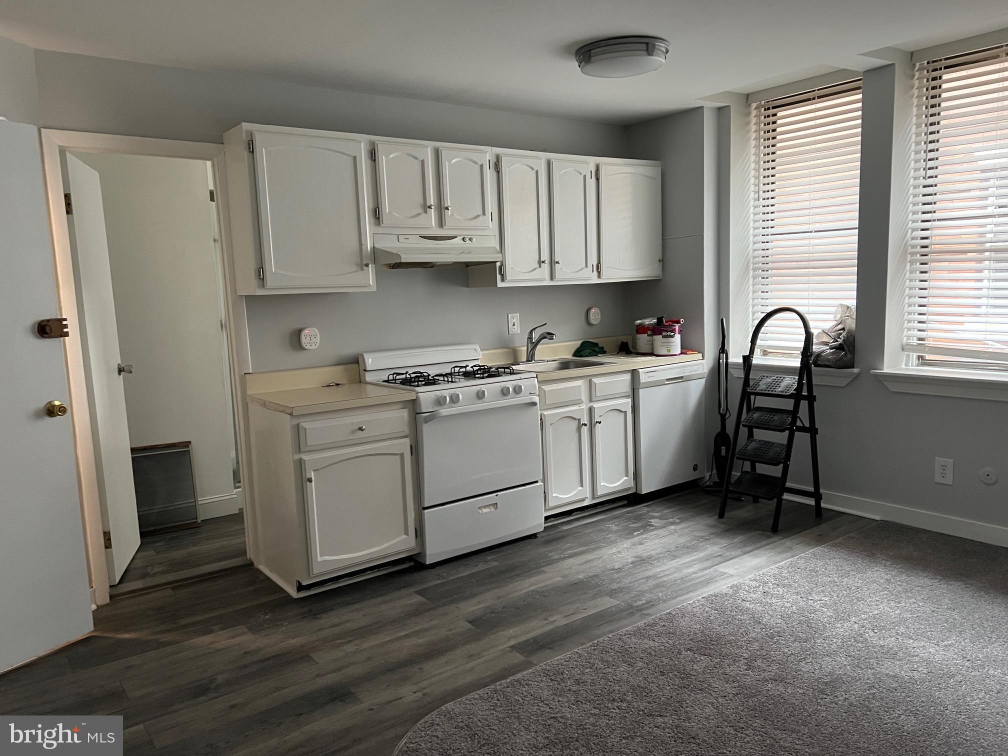 308 South Street, Unit 2 Philadelphia, PA 19147 - Photo 1 of 7 a kitchen with stainless steel appliances granite countertop a stove a sink a refrigerator and white cabinets