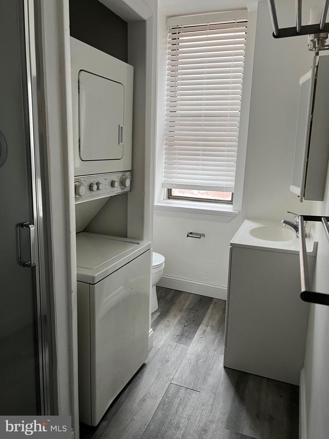 308 South Street, Unit 2 Philadelphia, PA 19147 - Photo 5 of 7 a utility room with a window dryer and washer