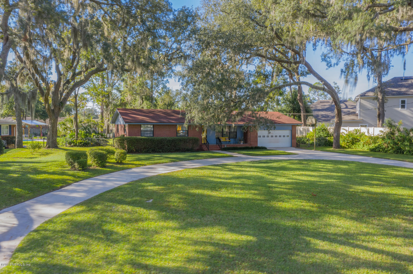 8702 Sanchez Road Jacksonville, FL 32217 - Photo 1 of 34 a house view with a garden space