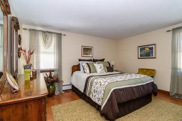 a bedroom with bed and a window