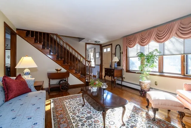 a living room with furniture and a rug