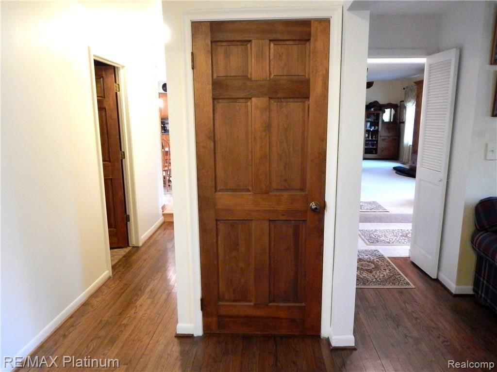 86 South Burkhart Road Howell, MI 48843 - Photo 23 of 52 These solid wood doors are a beautiful accent to the entire entry level.
