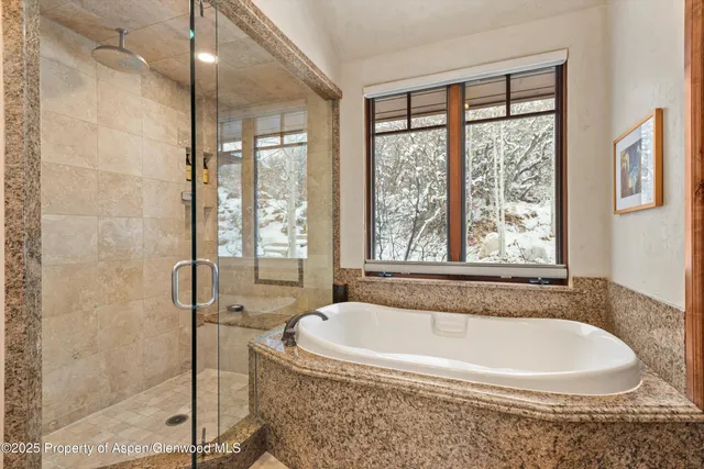 a bath tub sitting next to a window
