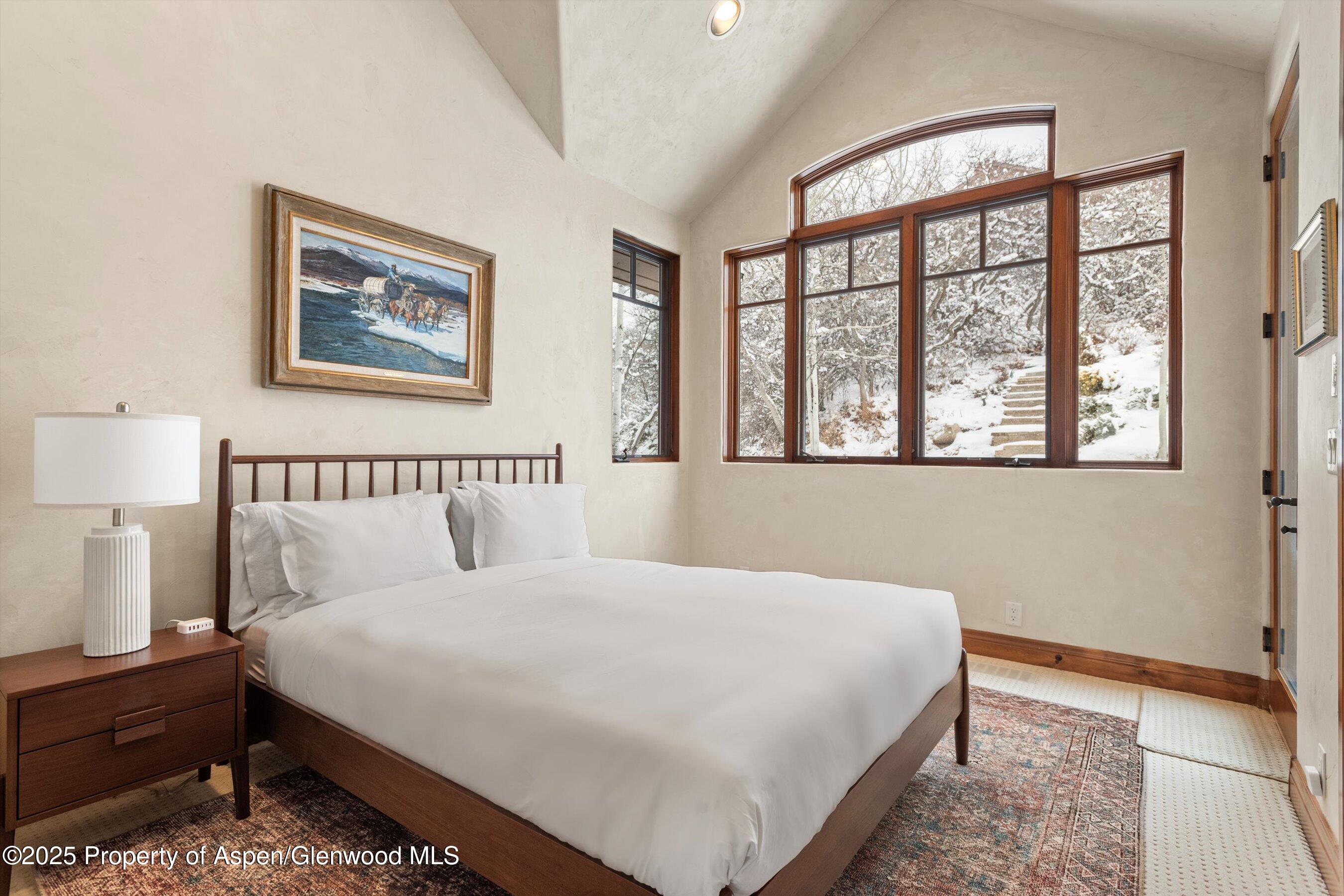 121 Oak Ridge Road Snowmass Village, CO 81615 - Photo 19 of 28 a bedroom with a large bed and a window
