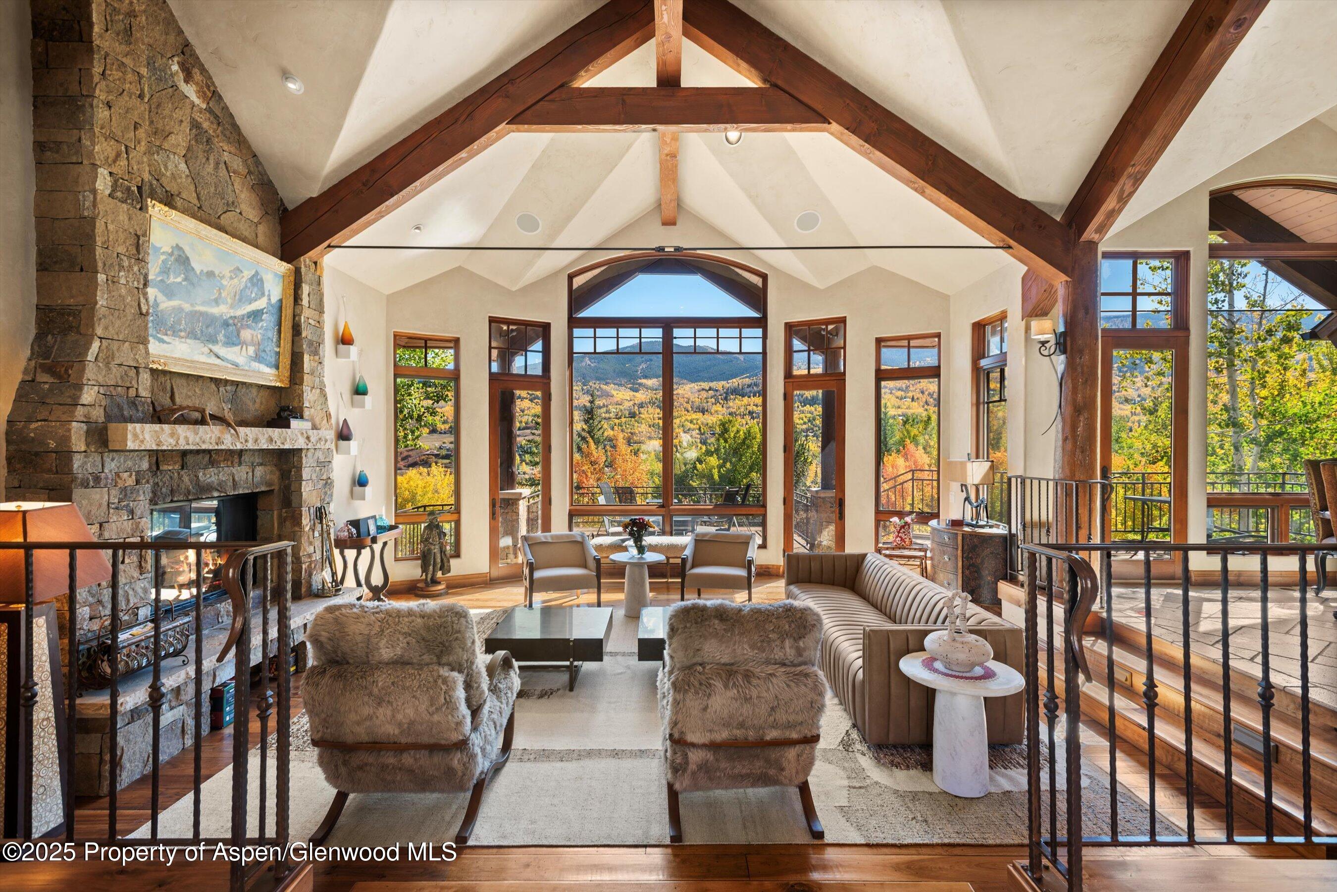 121 Oak Ridge Road Snowmass Village, CO 81615 - Photo 2 of 28 a living room with furniture and a large window