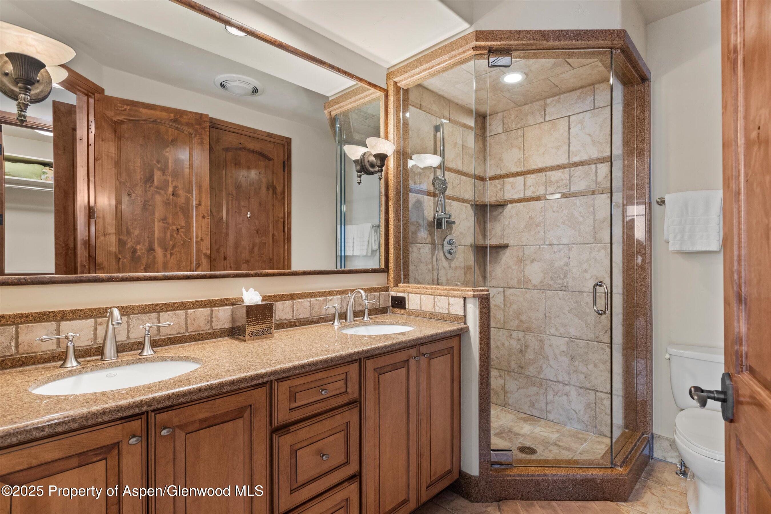 121 Oak Ridge Road Snowmass Village, CO 81615 - Photo 25 of 28 a bathroom with a granite countertop sink mirror and double