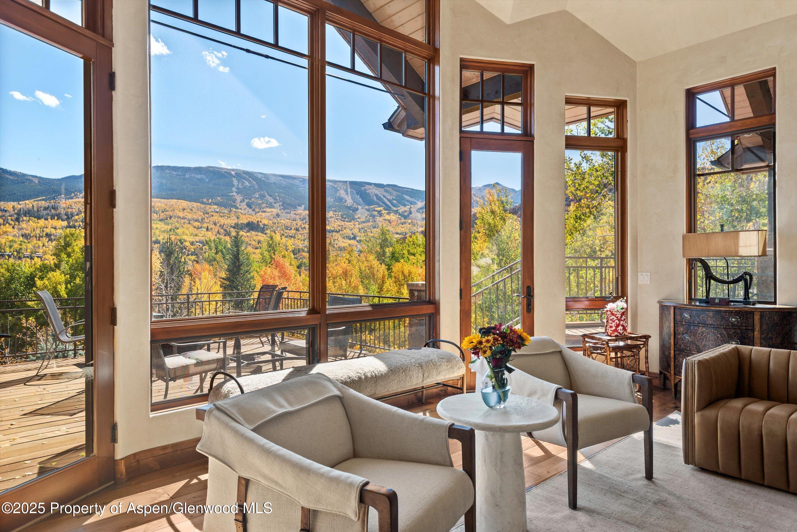 121 Oak Ridge Road Snowmass Village, CO 81615 - Photo 6 of 28 a living room with furniture and a large window