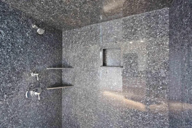 a bedroom with furniture and a chandelier