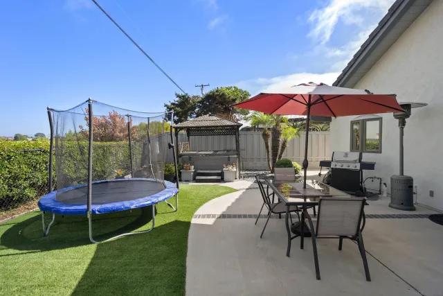a view of a house with a yard and plant