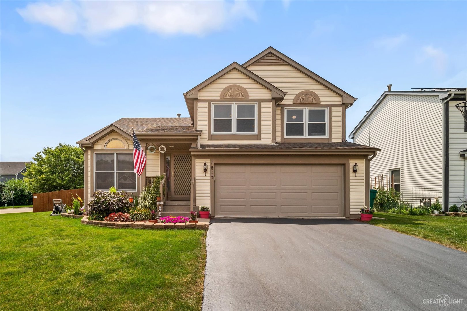 1813 Olde Mill Road Plainfield, IL 60586 - Photo 1 of 34 a front view of a house with a yard and garage
