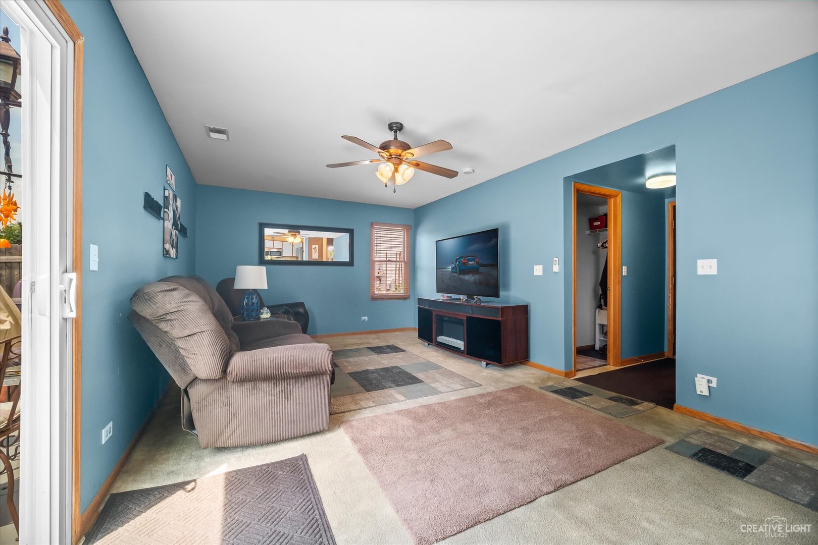1813 Olde Mill Road Plainfield, IL 60586 - Photo 14 of 34 a living room with furniture and a flat screen tv