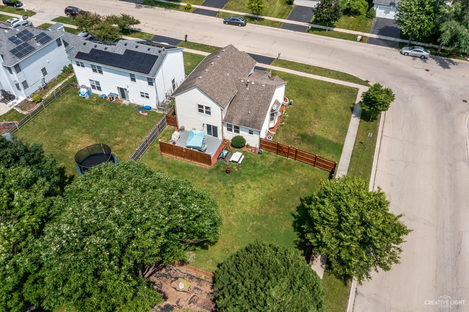 1813 Olde Mill Road Plainfield, IL 60586 - Photo 33 of 34 an aerial view of a house with a garden and swimming pool