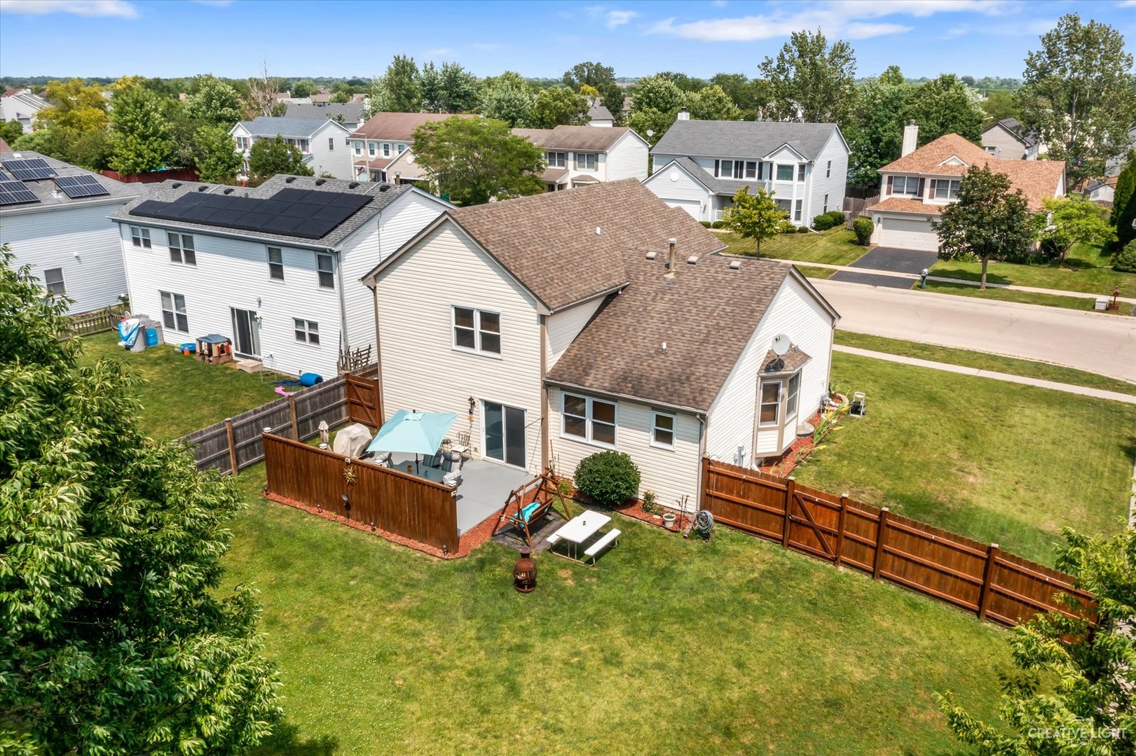 1813 Olde Mill Road Plainfield, IL 60586 - Photo 34 of 34 a aerial view of a house with swimming pool and a yard