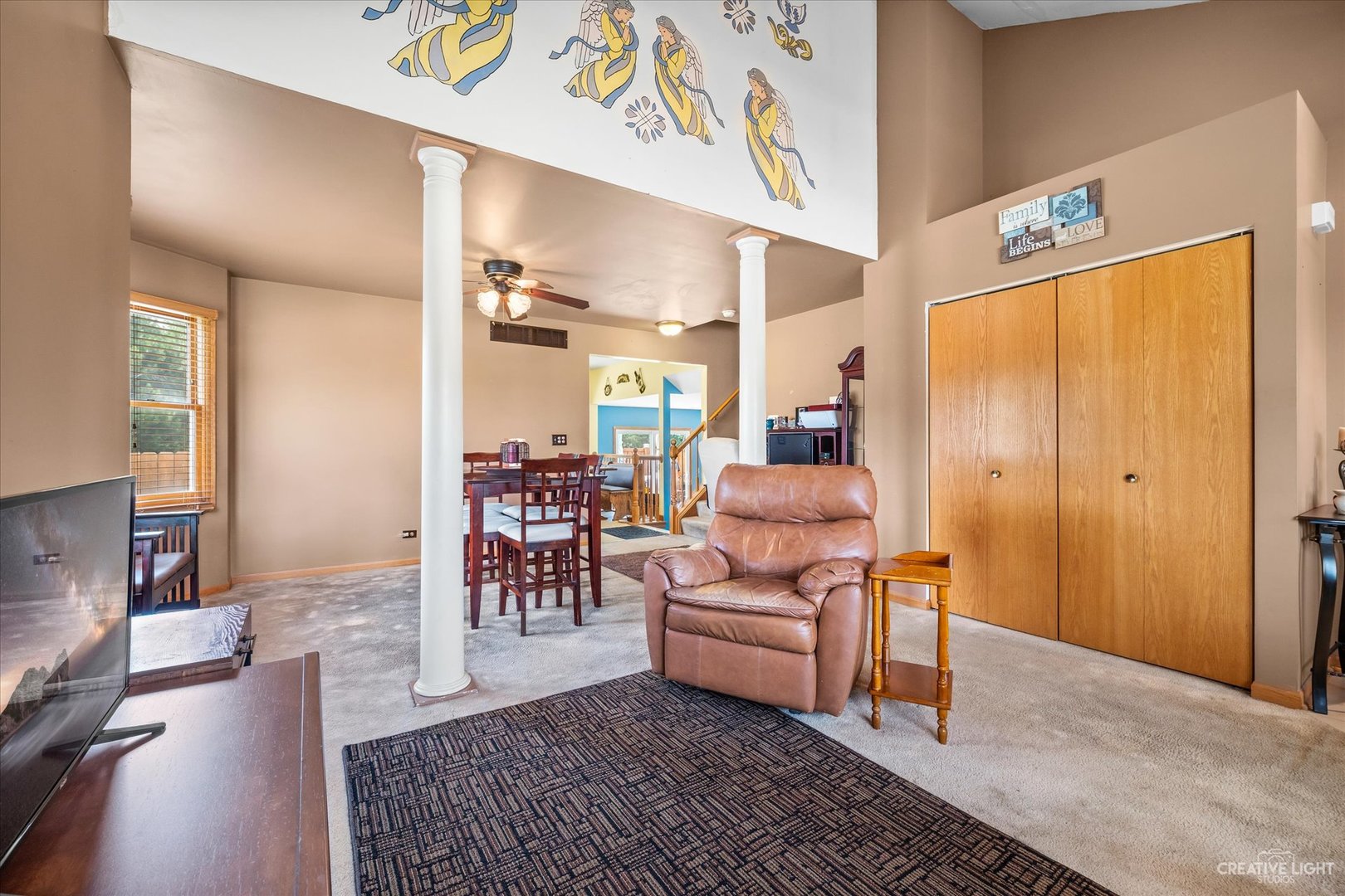 1813 Olde Mill Road Plainfield, IL 60586 - Photo 7 of 34 a living room with furniture rug and outdoor view