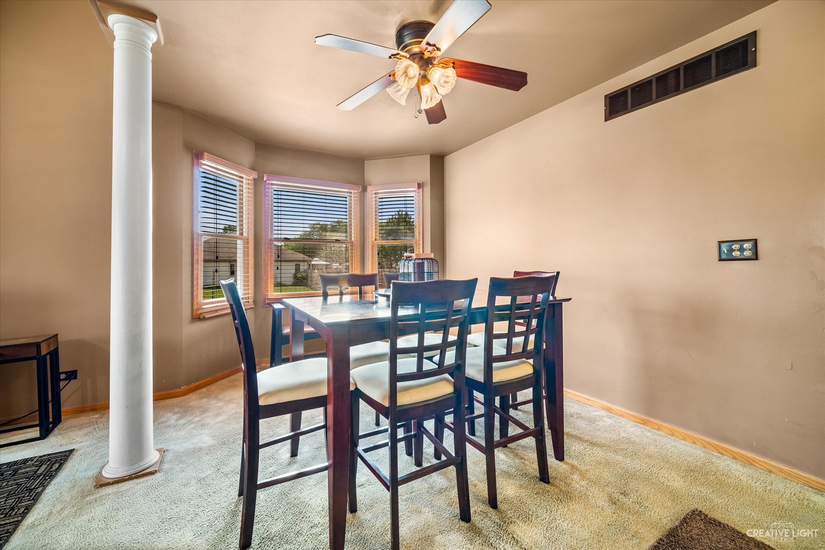 1813 Olde Mill Road Plainfield, IL 60586 - Photo 9 of 34 a view of a dining room with furniture window and outside view