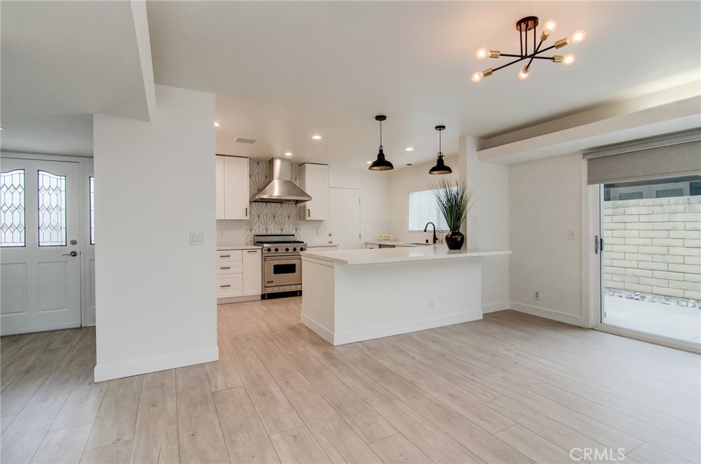 4541 Myra Avenue Cypress, CA 90630 - Photo 12 of 42 a view of kitchen with wooden floor electronic appliances and window