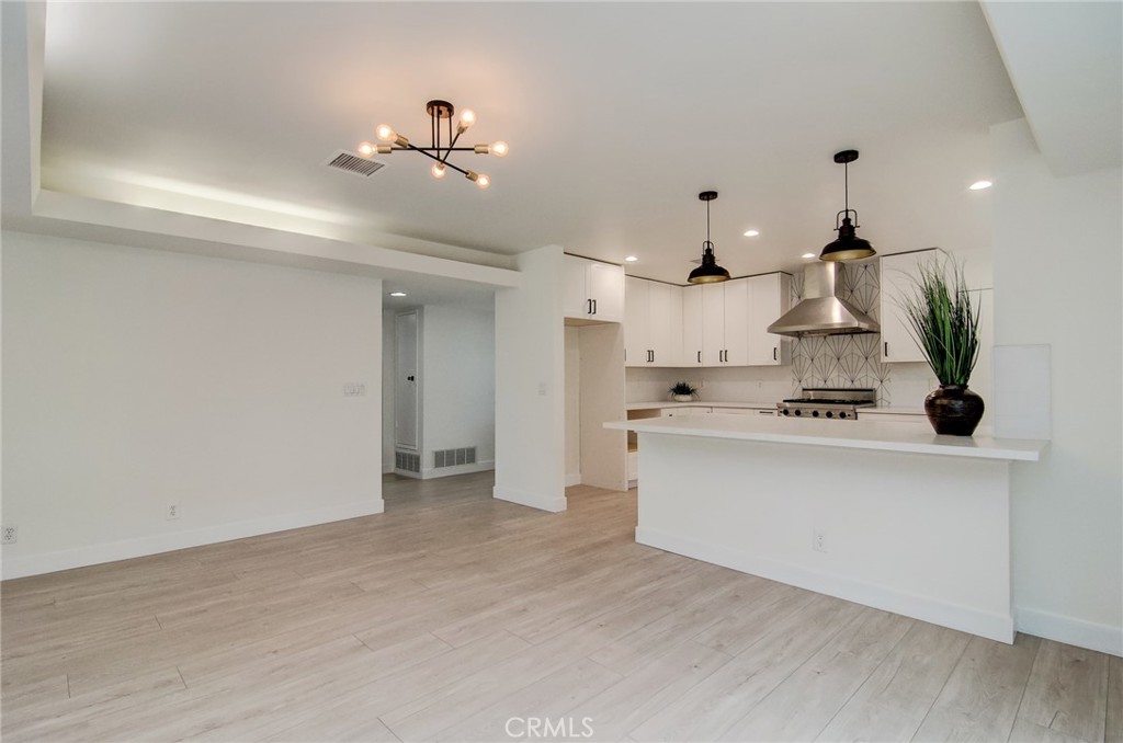 4541 Myra Avenue Cypress, CA 90630 - Photo 13 of 42 a view of kitchen with refrigerator and white cabinets