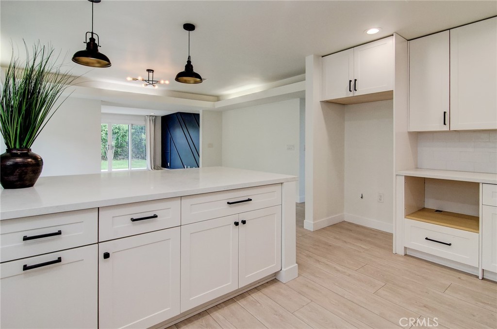 4541 Myra Avenue Cypress, CA 90630 - Photo 15 of 42 a kitchen with a sink and a stove top oven