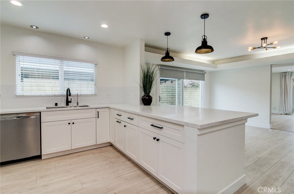 4541 Myra Avenue Cypress, CA 90630 - Photo 17 of 42 a kitchen with white cabinets and sink