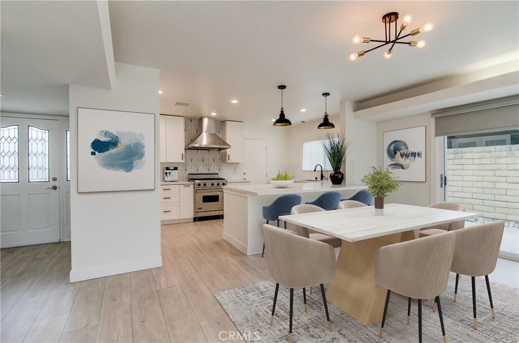 4541 Myra Avenue Cypress, CA 90630 - Photo 2 of 42 a kitchen with stainless steel appliances kitchen island granite countertop a table chairs and a refrigerator