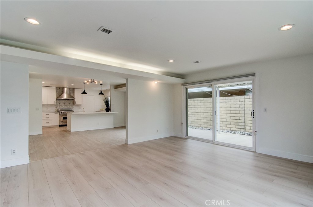 4541 Myra Avenue Cypress, CA 90630 - Photo 21 of 42 a view of an empty room with wooden floor